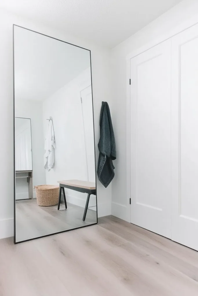 Minimalist mudroom ideas entryway featuring sleek storage bench white walls and hardwood flooring mudroom minimalist