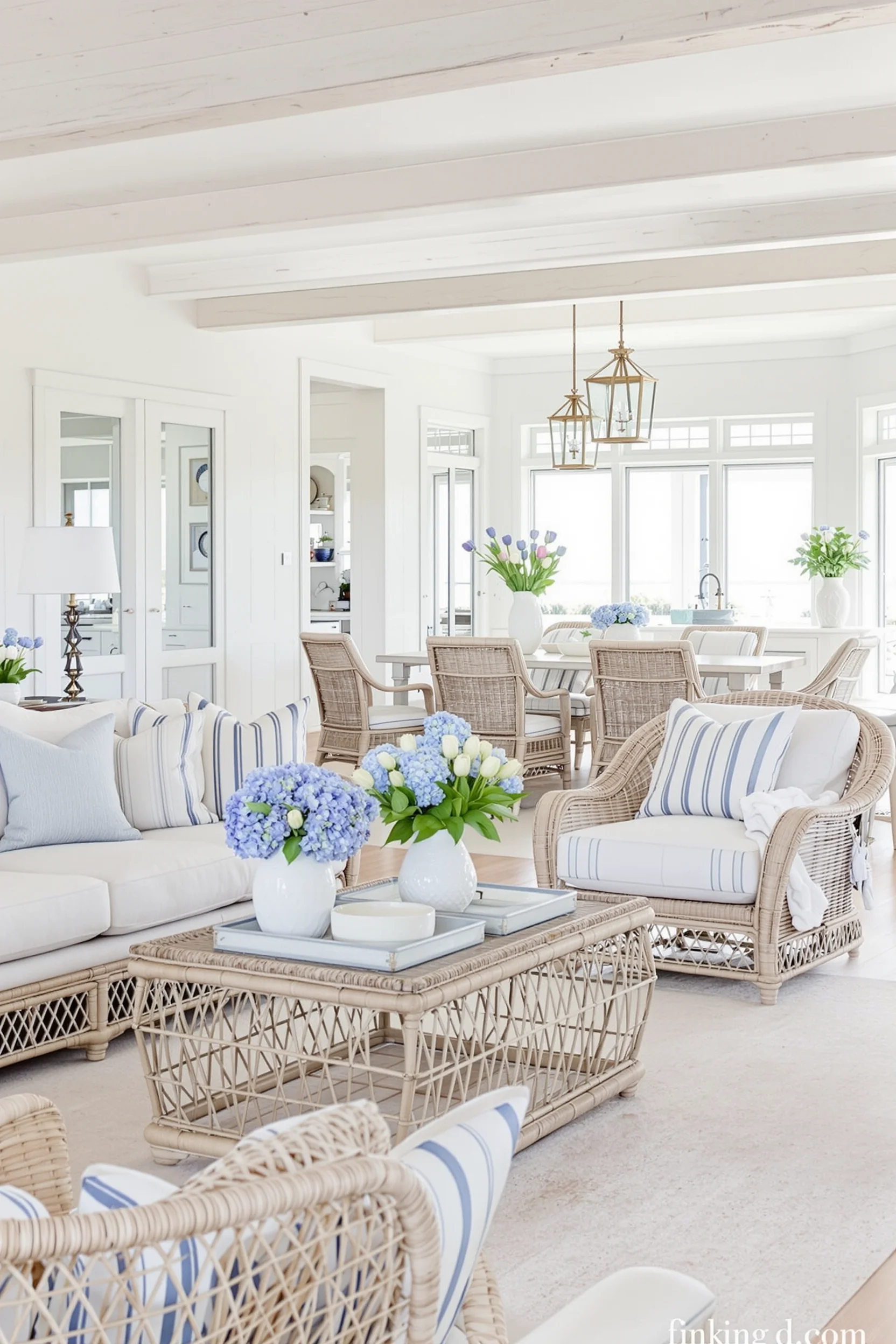 beach theme living room with weathered wood accents natural rattan table cream sofa blue pillows and coastal decor