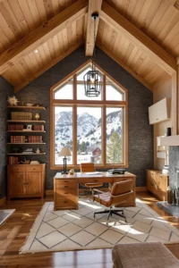 mountain home office ideas featuring timber ceiling beams stone accent wall and panoramic alpine window views with leather chair