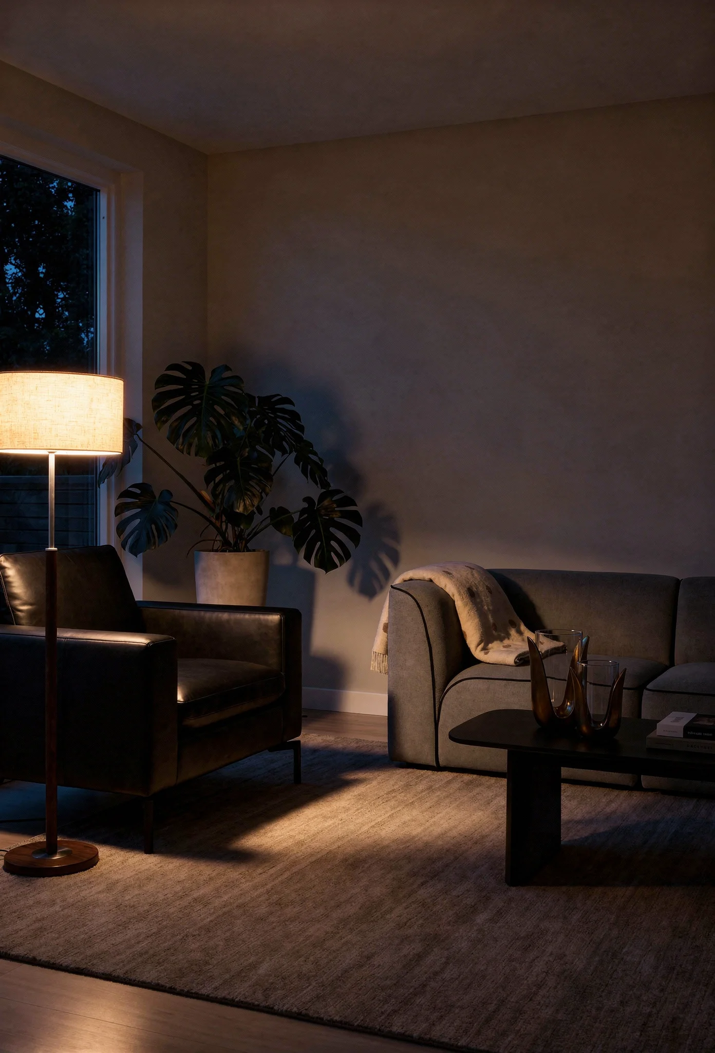 How to design a modern living room featuring gray modular sofa with sculptural ceramic side table evening mood