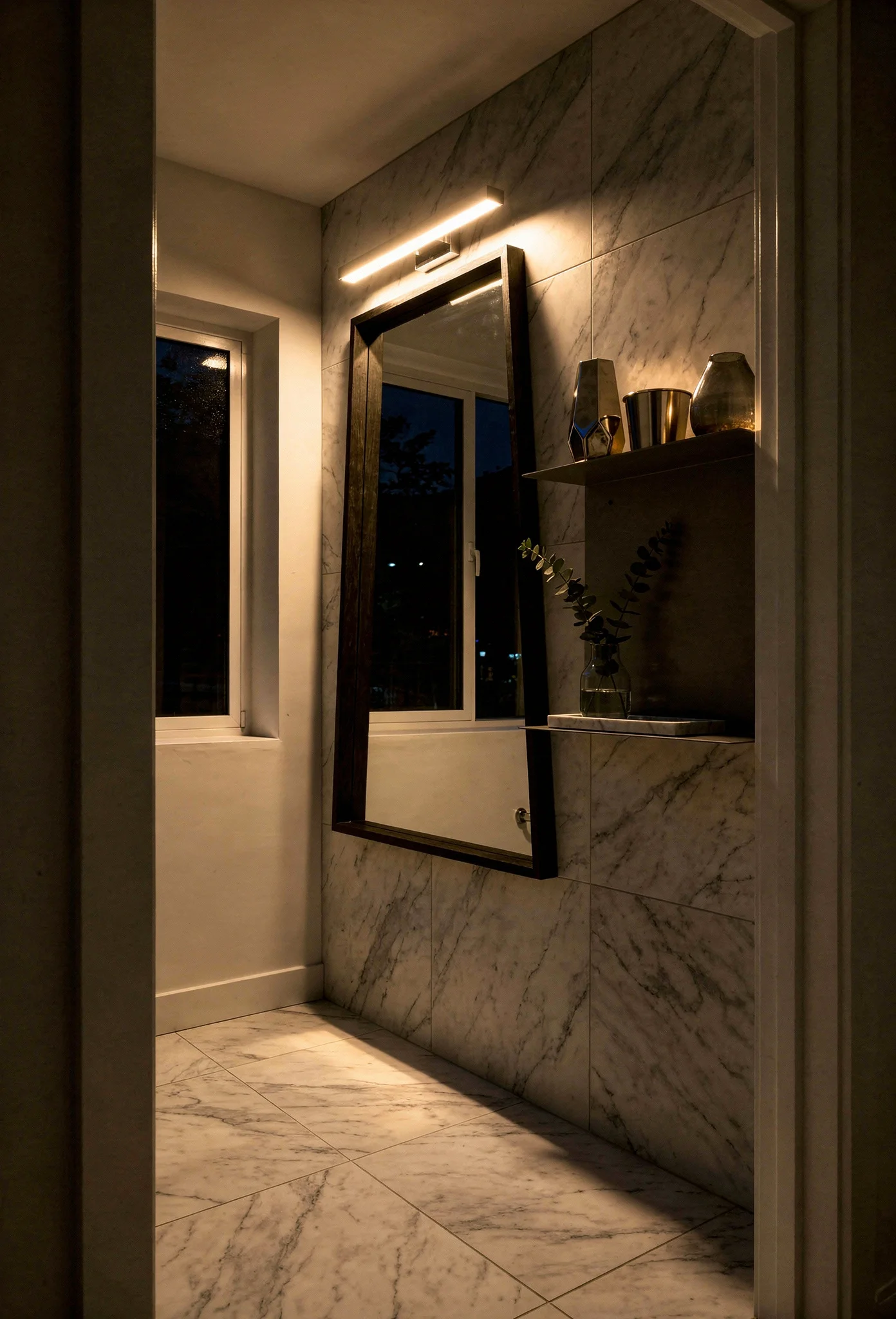 Modern small bathroom tile featuring black oak framed mirror with chrome vanity light and marble porcelain walls evening mood