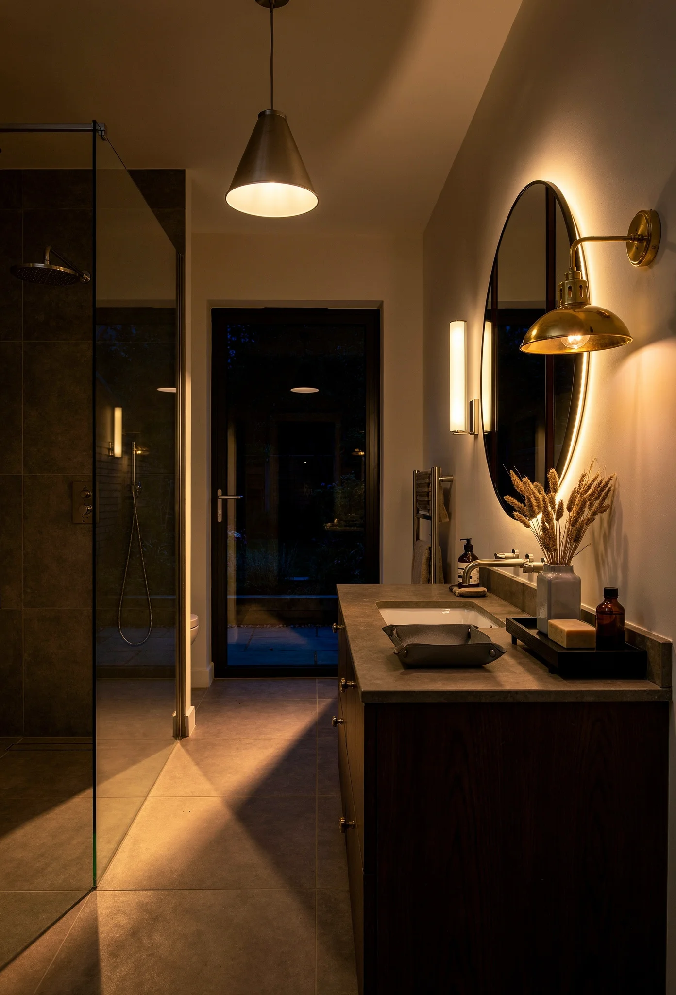 Modern small bathroom lighting featuring art deco stained glass mirror with layered sconces and pendant evening mood