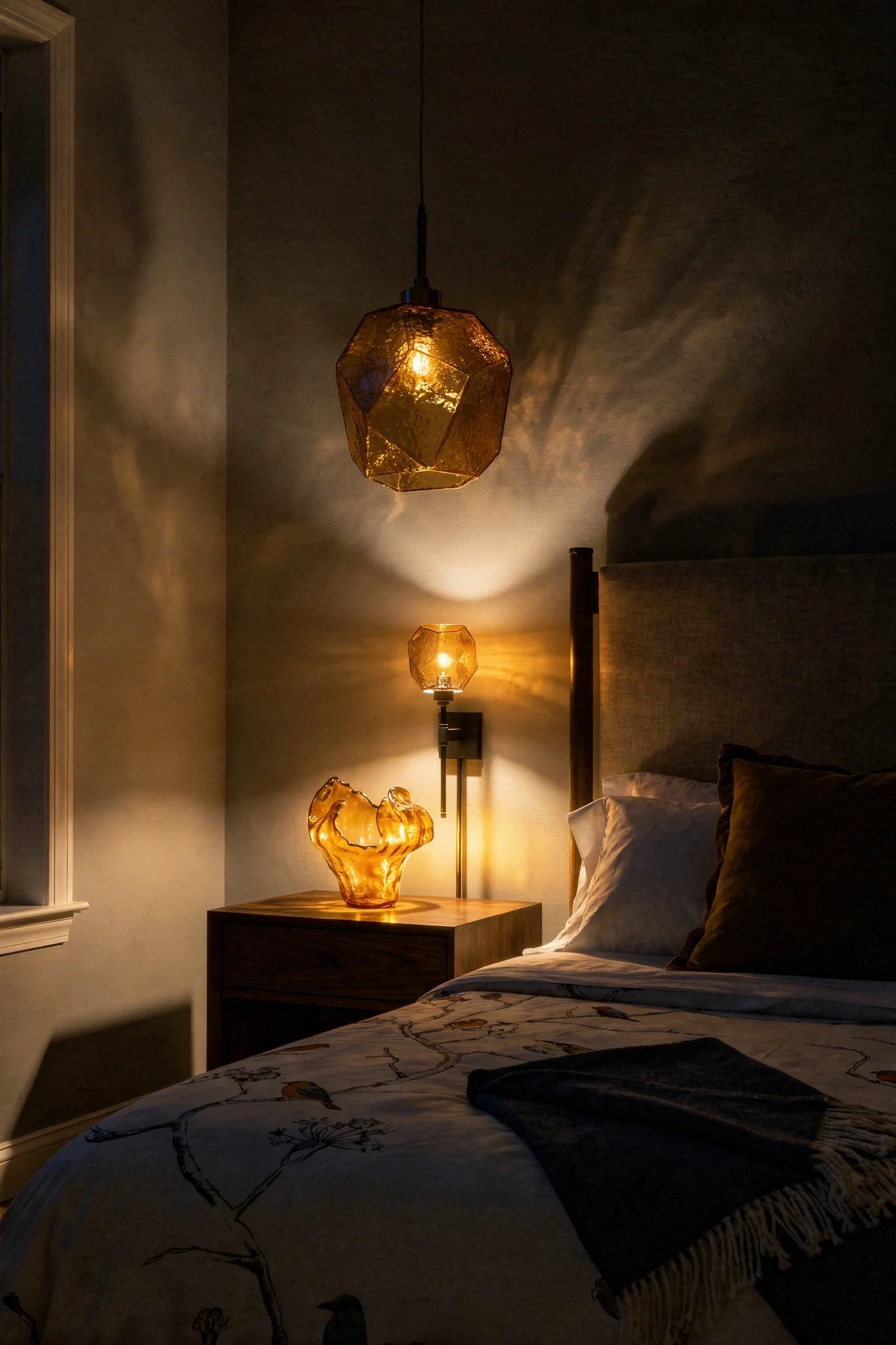 French Country Bedrooms featuring amber blown glass pendant with linen bed and walnut nightstand evening mood