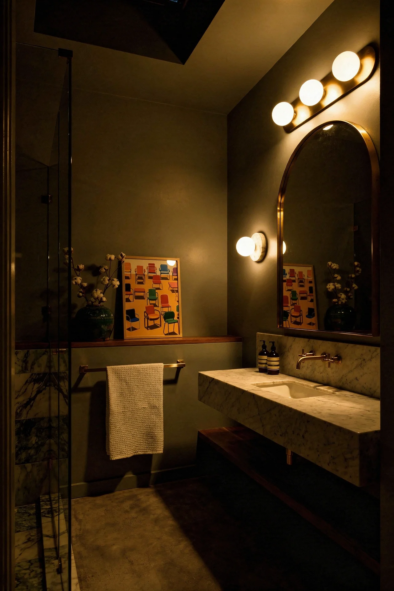 Mid Century Modern Bathroom featuring long 3-globe linear glass vanity light with marble disc wall light accent fixture evening mood