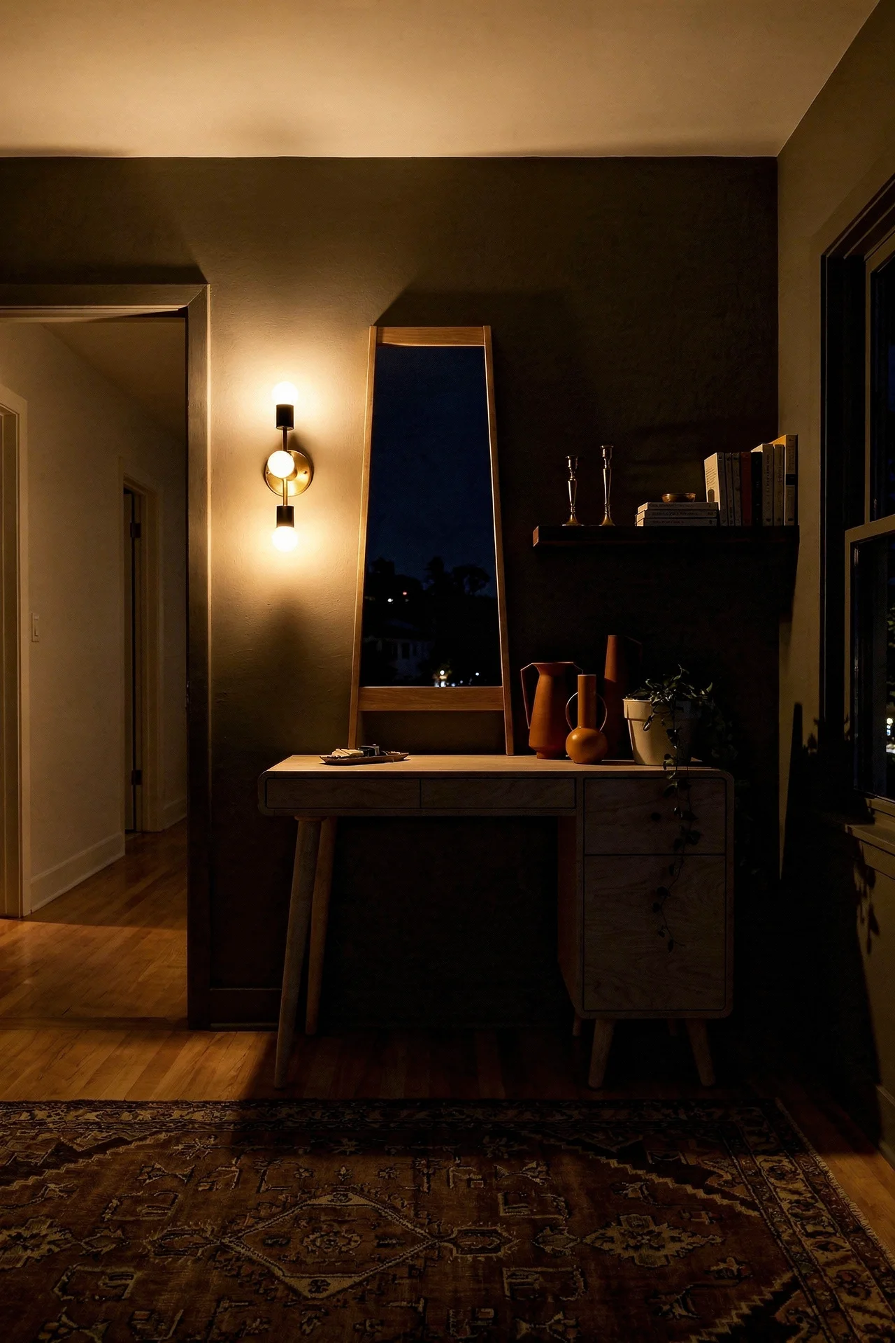 Mid Century Modern Bathroom featuring birch plywood MCM vanity desk with tapered legs with 3-light brass Brontes mid century vanity evening mood