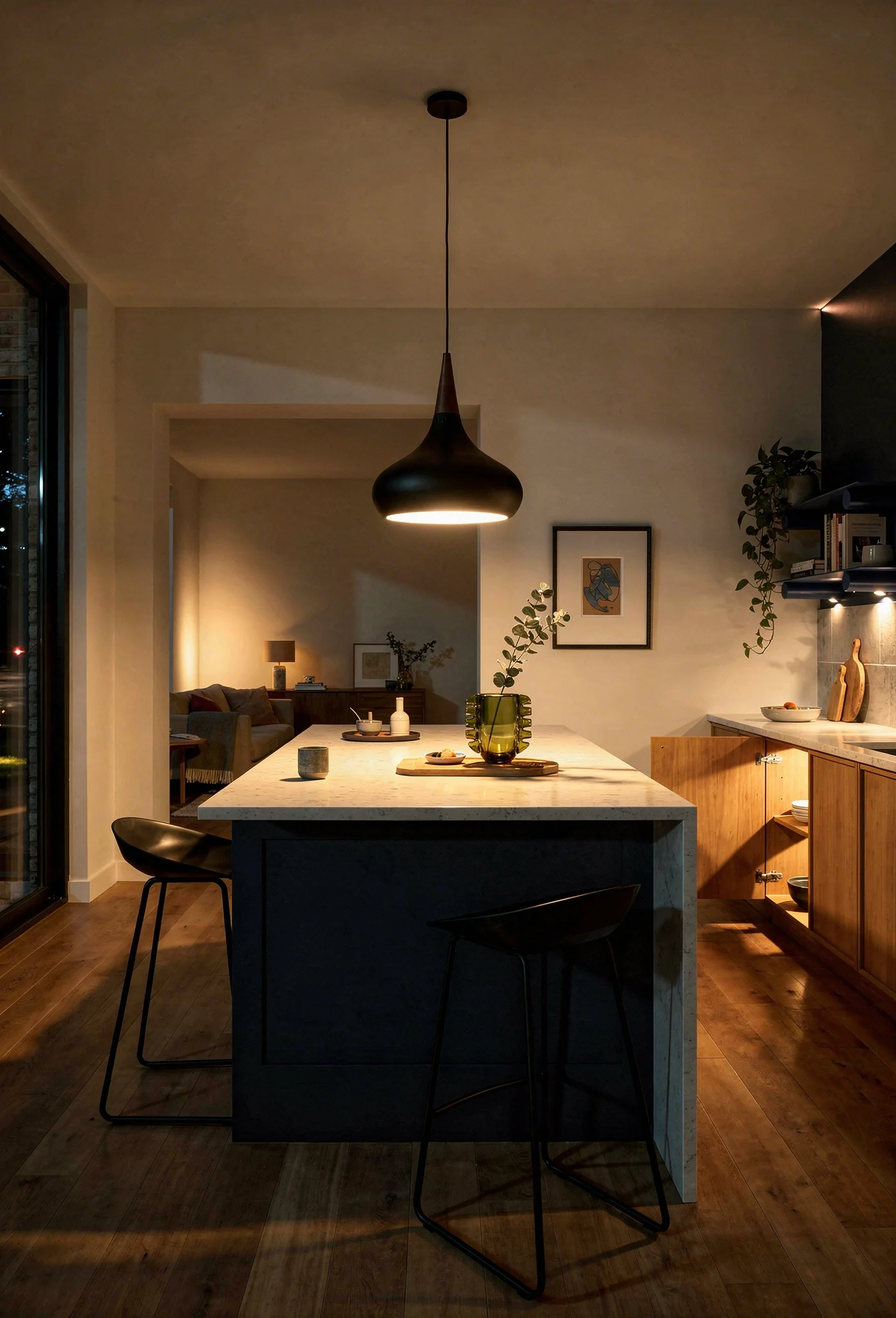 Modern kitchen earthy colors featuring black oak pendant over navy island with warm oak cabinets evening mood