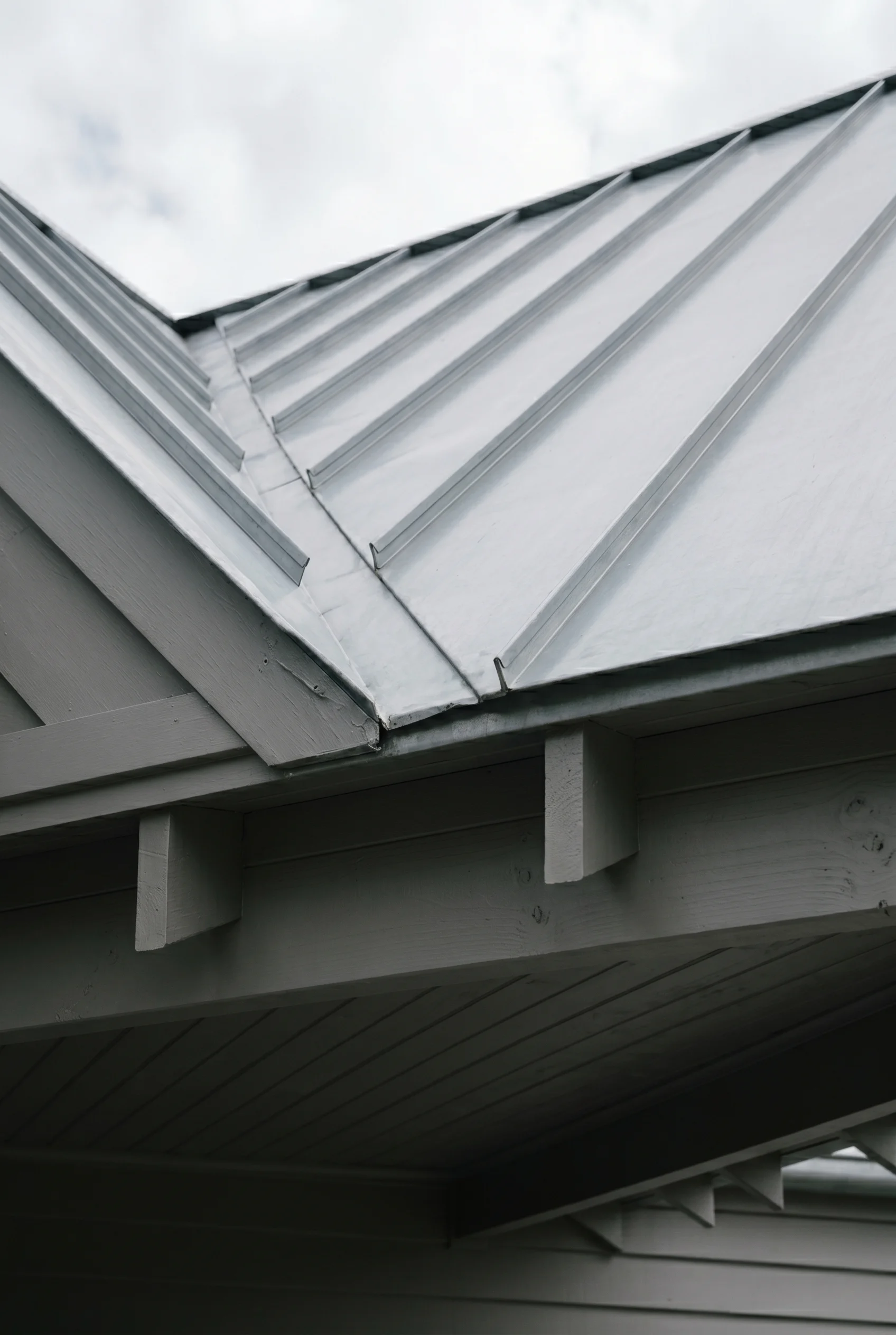 Victorian Exterior design scene against Plummett mid-grey painted porch ceiling boards below the metal roof walls