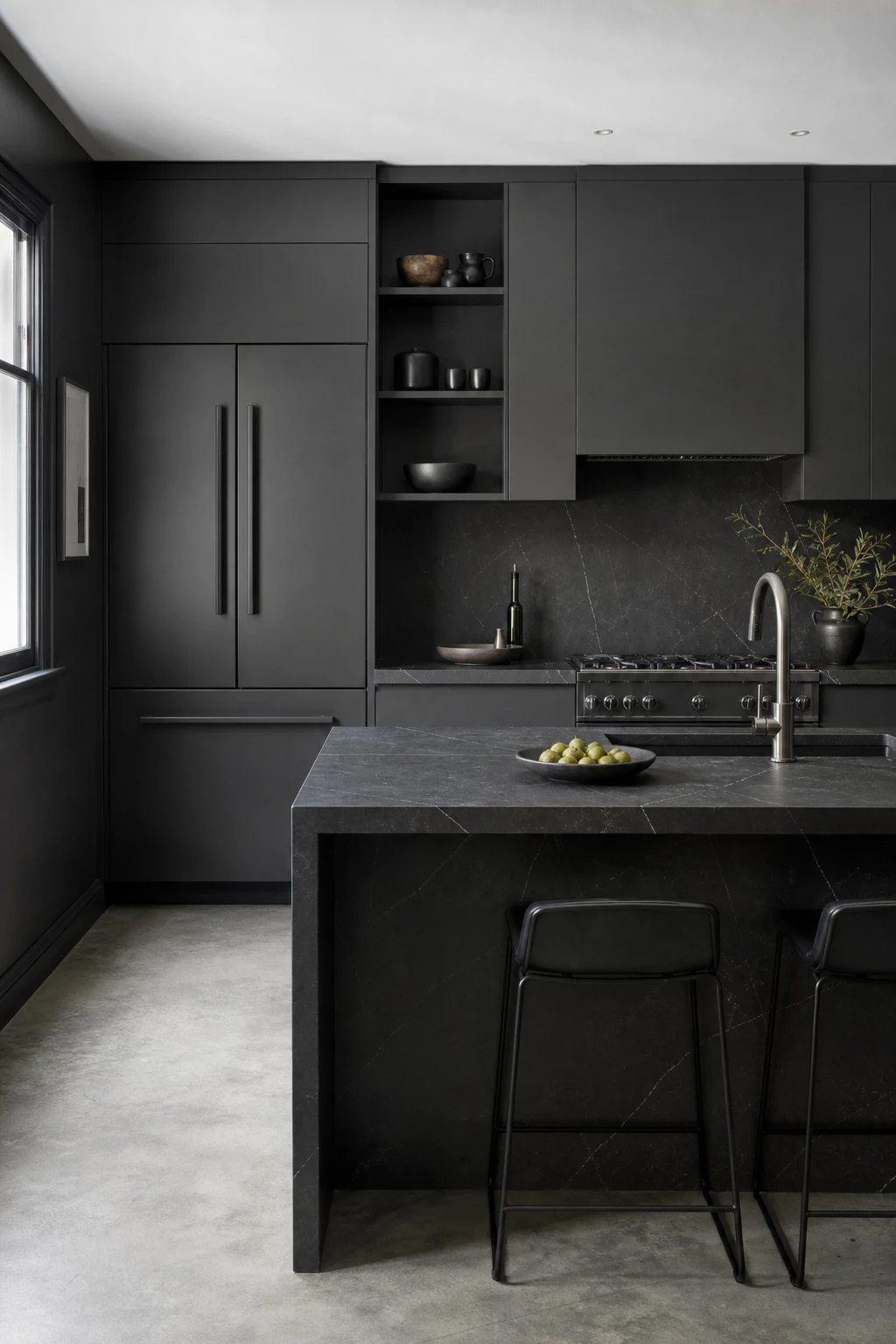 Charcoal gray kitchen with dark grey appliances blending into cabinetry, matte slate finishes, integrated handles, and Farrow and Ball Smelt Black painted walls
