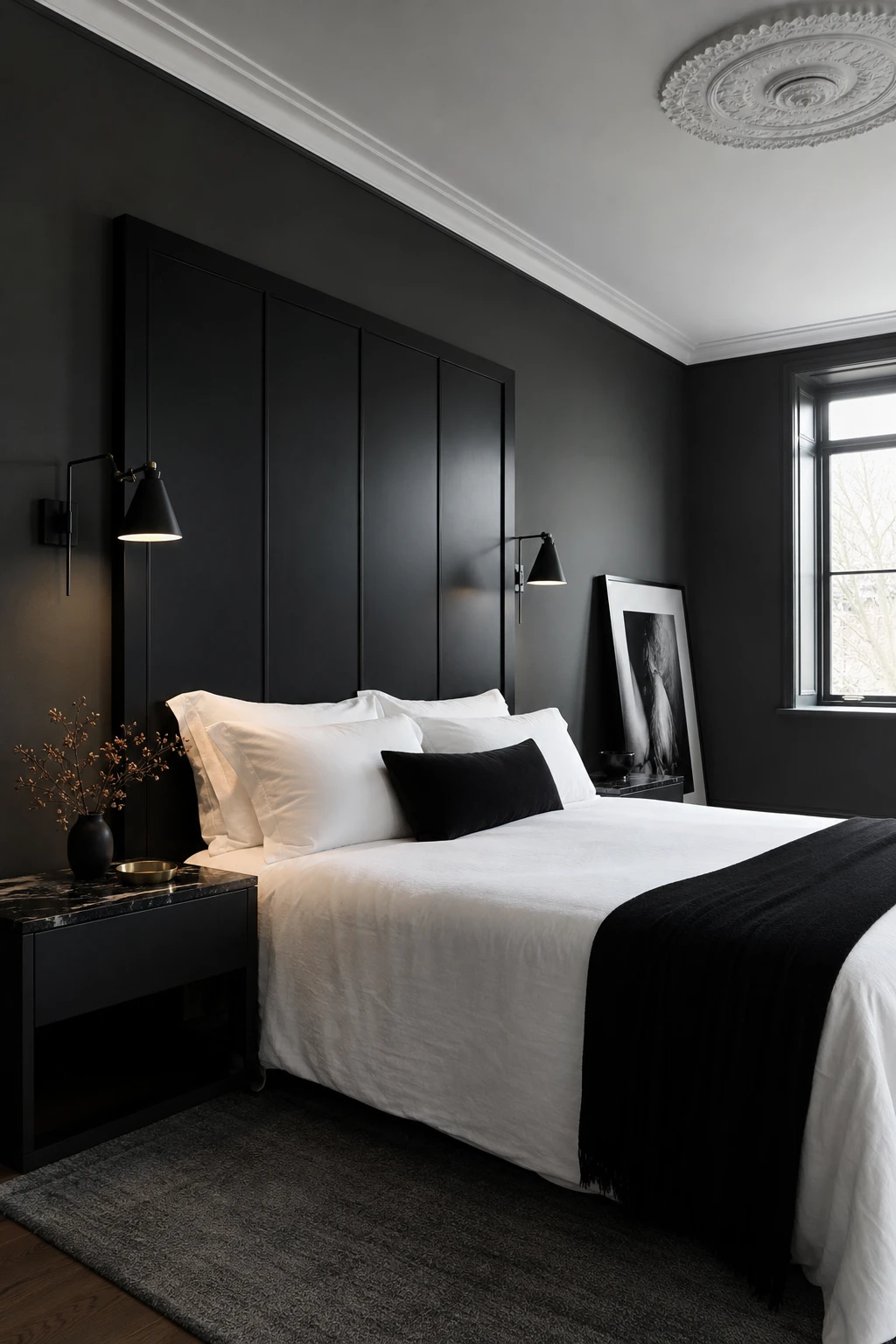 Dark gray bedroom with black and white high contrast palette, crisp white bedding, black framed headboard, and Farrow and Ball Blackened painted walls in soft cool white