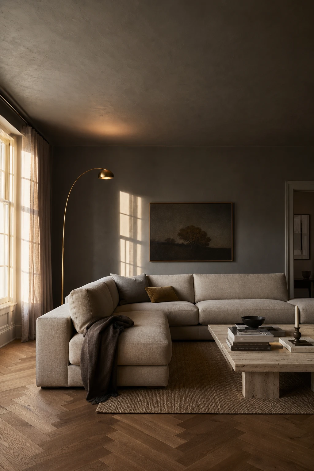 Gray accent wall living room with a Plummett grey ceiling wrapping the space in deep tone, anchored by a linen sofa, brass lamp, and herringbone oak floor