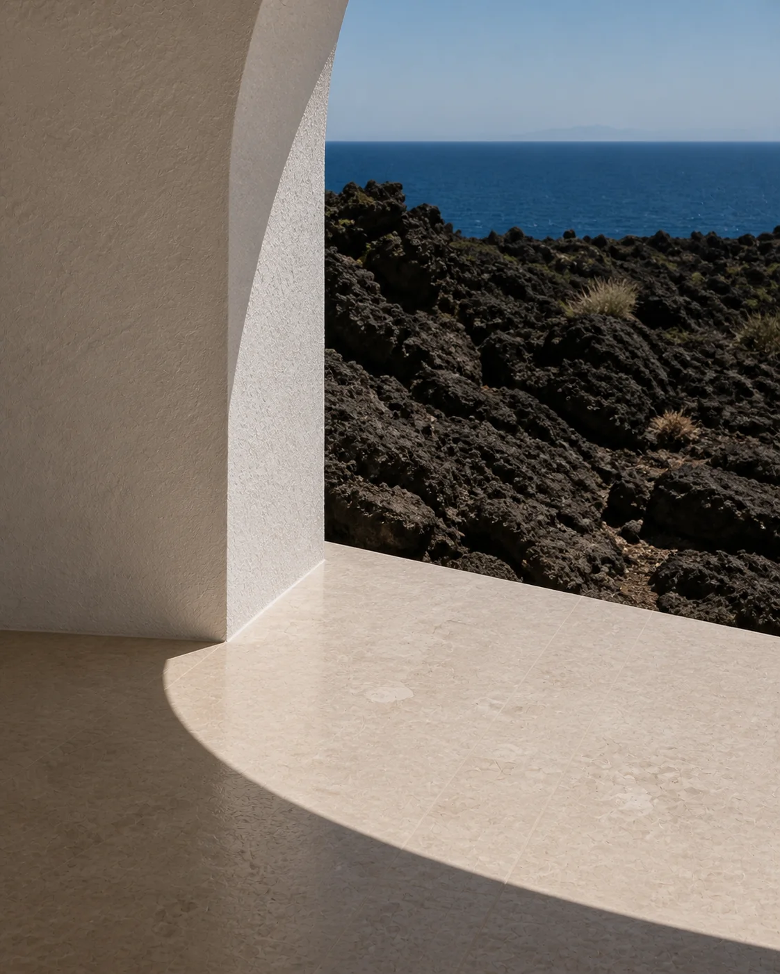 Terrace detail of honed limestone volcanic rock chalk white plaster and the Aegean horizon beyond the Milos house part of an editorial architecture walkthrough of a fictional house