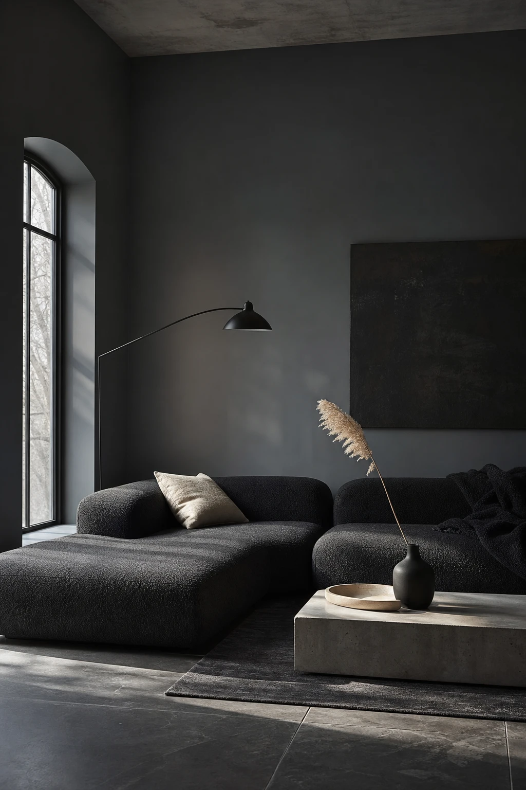 Dark minimalist Nordic noir living corner with pale birch tray and bleached linen cushions against Farrow and Ball Pigeon grey walls